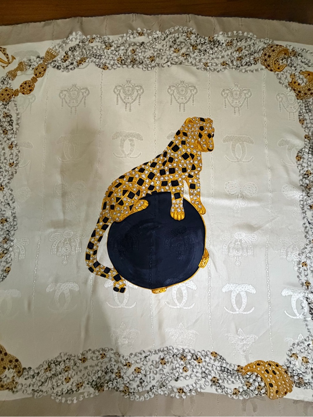 Must De Cartier Embellished Leopard Silk Scarf in cream and Gold.